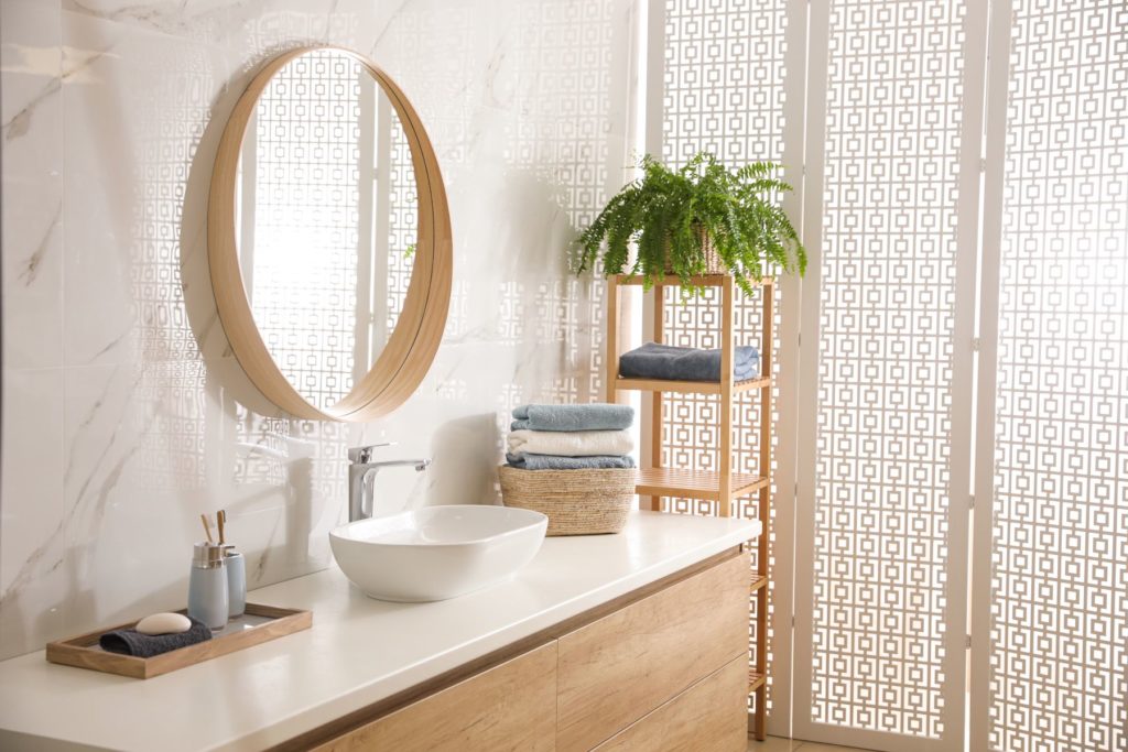 Stylish bathroom interior with mirror and countertop. Design idea